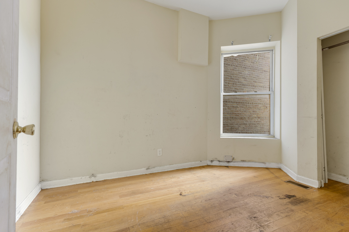 1141 South St Louis Avenue Chicago, IL 60624 - Photo 8 of 26 an empty room with windows