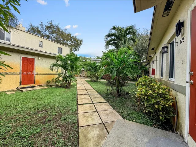 a view of backyard with a garden and plants
