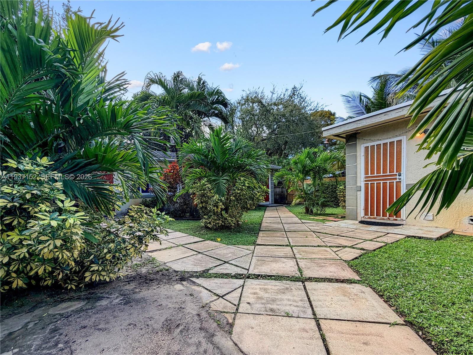 426 Northeast 77th Street, Unit 428 Miami, FL 33138 - Photo 16 of 22 a view of a backyard with plants