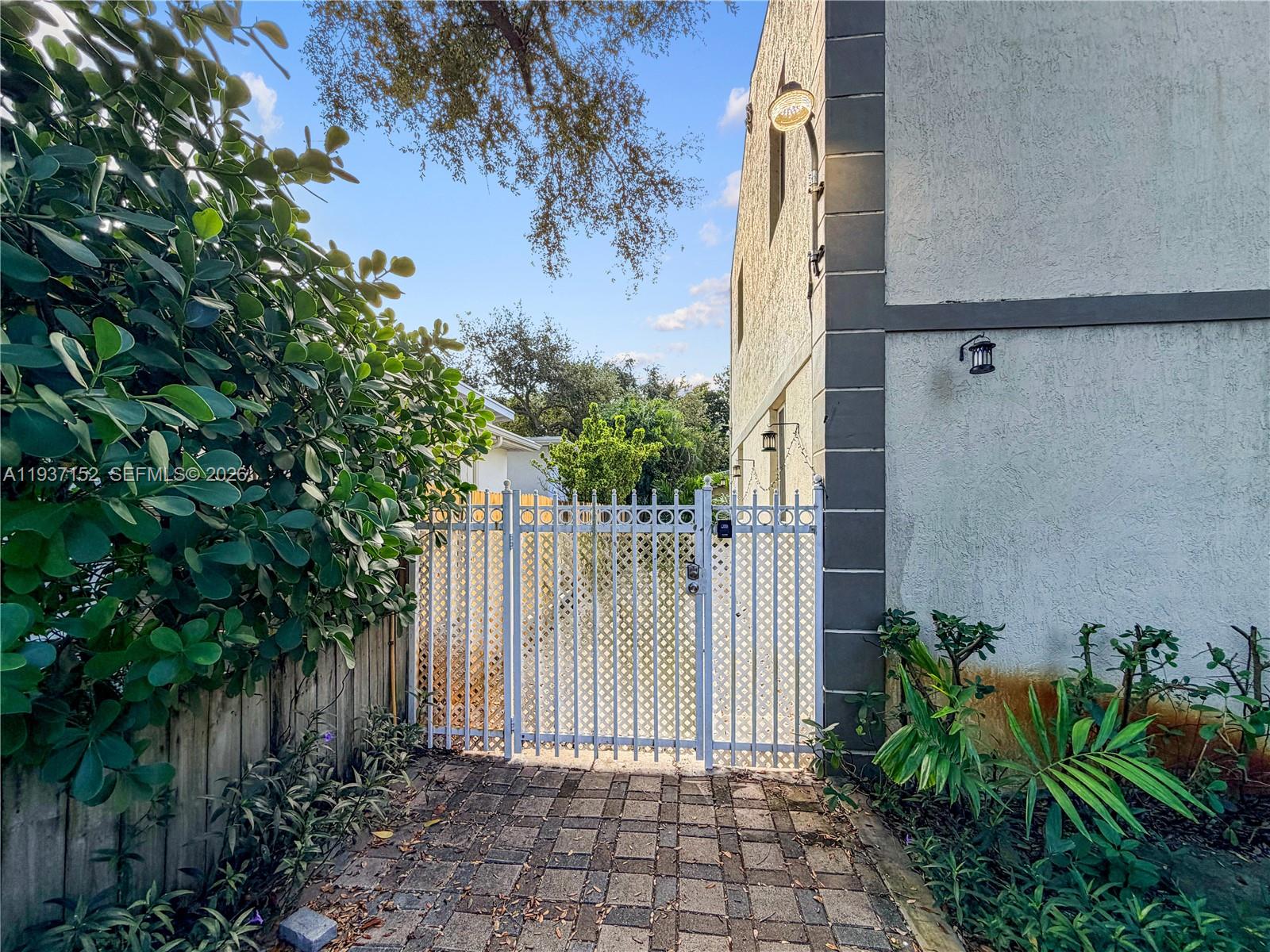 426 Northeast 77th Street, Unit 428 Miami, FL 33138 - Photo 17 of 22 a view of a pathway of a house with a small yard