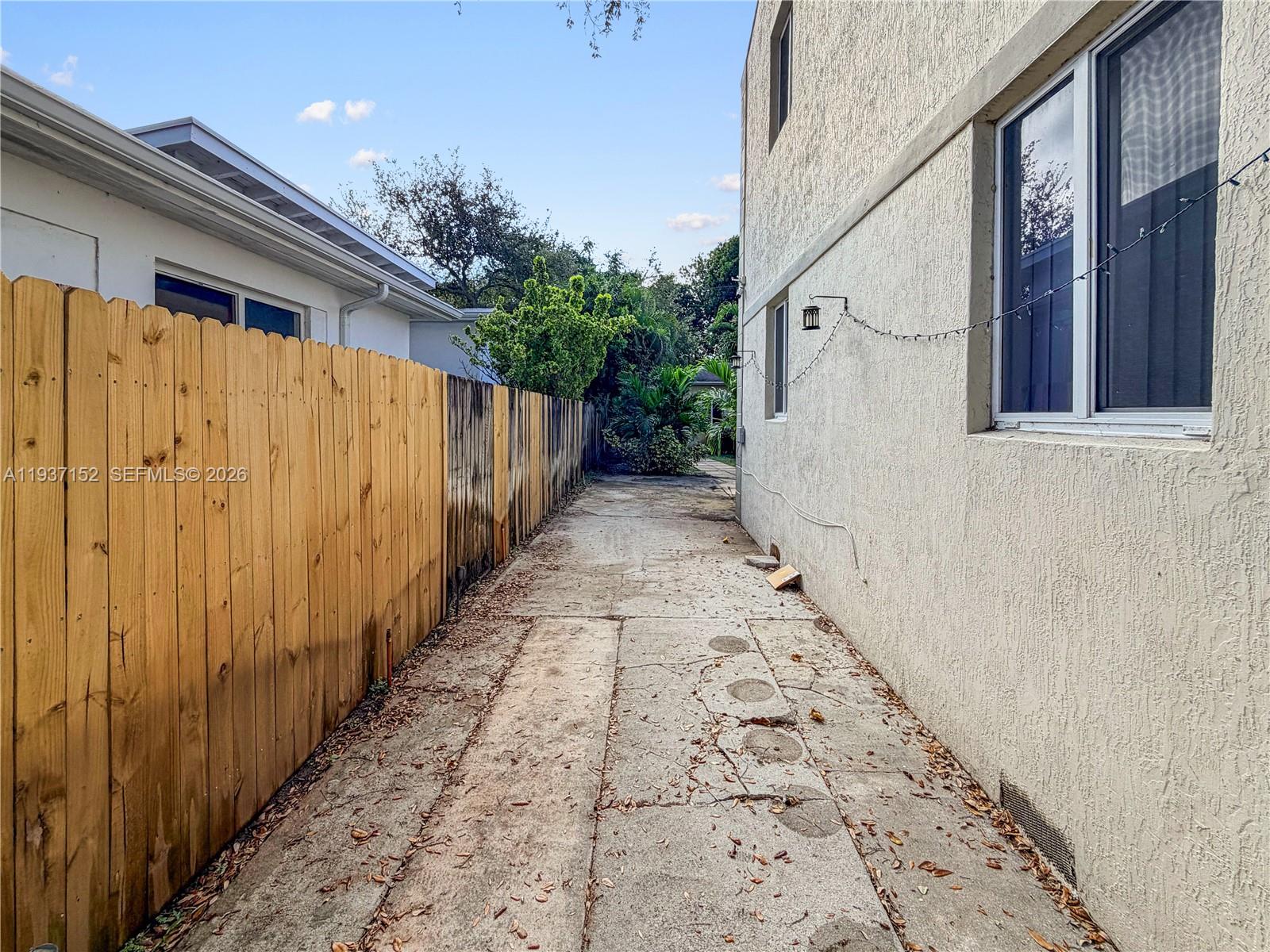 426 Northeast 77th Street, Unit 428 Miami, FL 33138 - Photo 18 of 22 a view of a pathway with a house