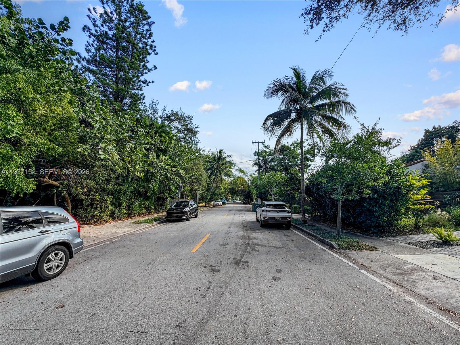 426 Northeast 77th Street, Unit 428 Miami, FL 33138 - Photo 19 of 22 a view of car parked on street side