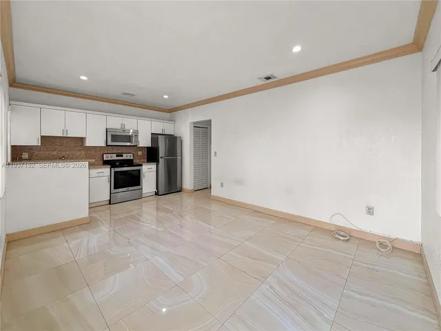 a view of a kitchen with a sink