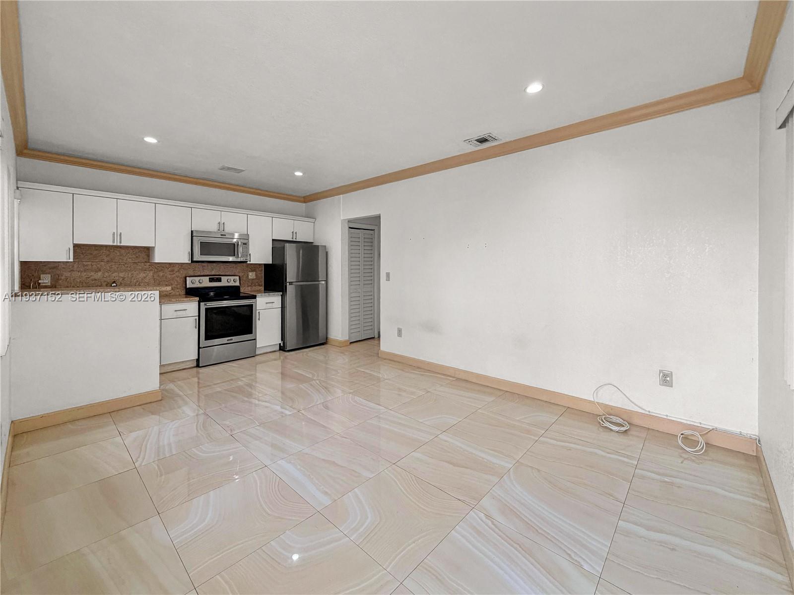426 Northeast 77th Street, Unit 428 Miami, FL 33138 - Photo 2 of 22 a view of a kitchen with a sink