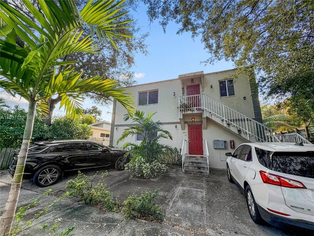 a view of car parked in front of house