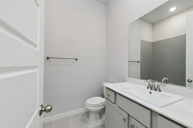 a bathroom with a sink toilet and vanity