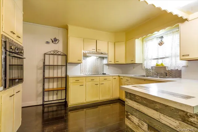 a kitchen with stainless steel appliances granite countertop a sink and cabinets