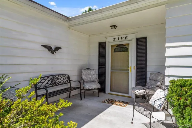 a front view of a house with patio