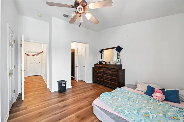 a bathroom with a sink vanity mirror and toilet