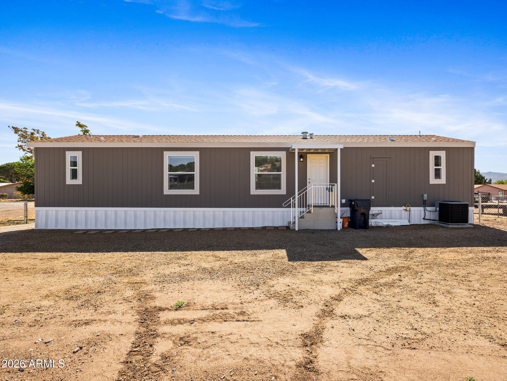 18296 Frontier Road Peeples Valley, AZ 86332 - Photo 27 of 44 a view of a house with a yard
