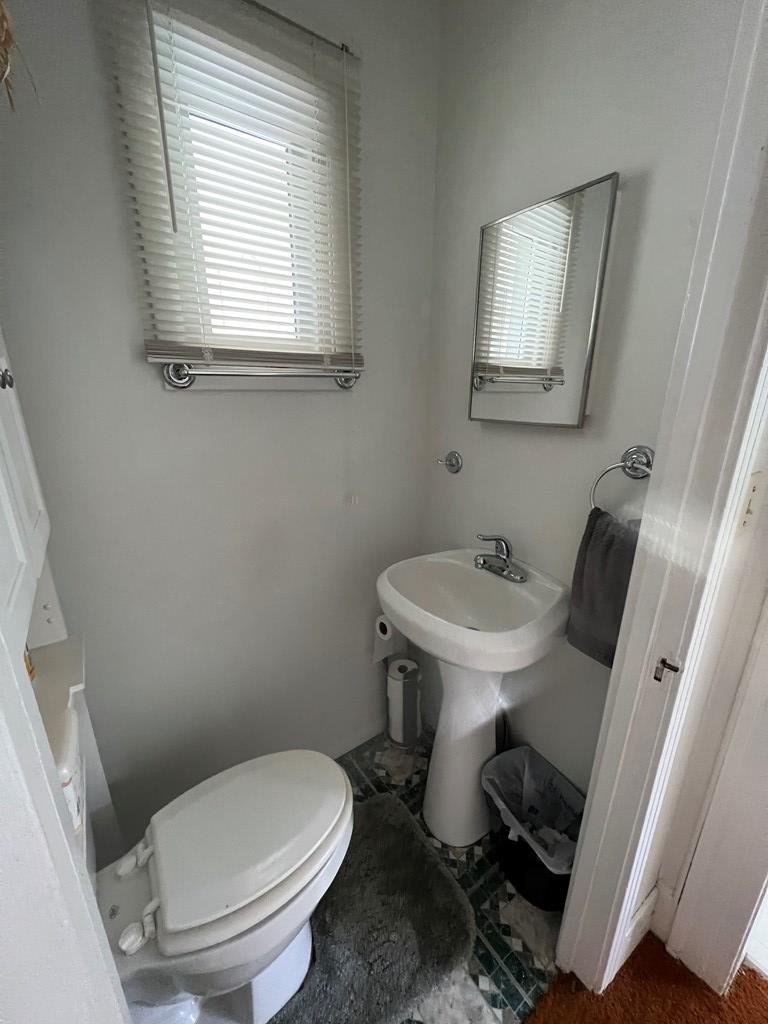 1360 Pittsburgh Road Franklin, PA 16323 - Photo 10 of 16 a white toilet sitting next to a bathroom sink