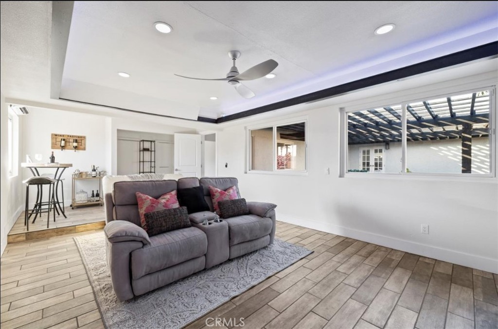 19472 Catfish Circle Huntington Beach, CA 92646 - Photo 12 of 30 a living room with furniture and a ceiling fan