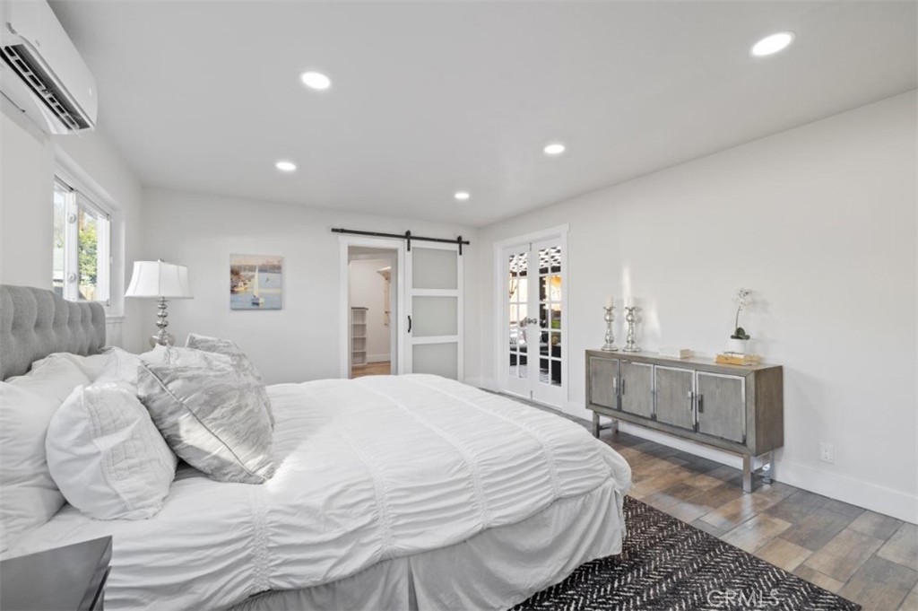 19472 Catfish Circle Huntington Beach, CA 92646 - Photo 17 of 30 a bedroom with a bed and a cabinets