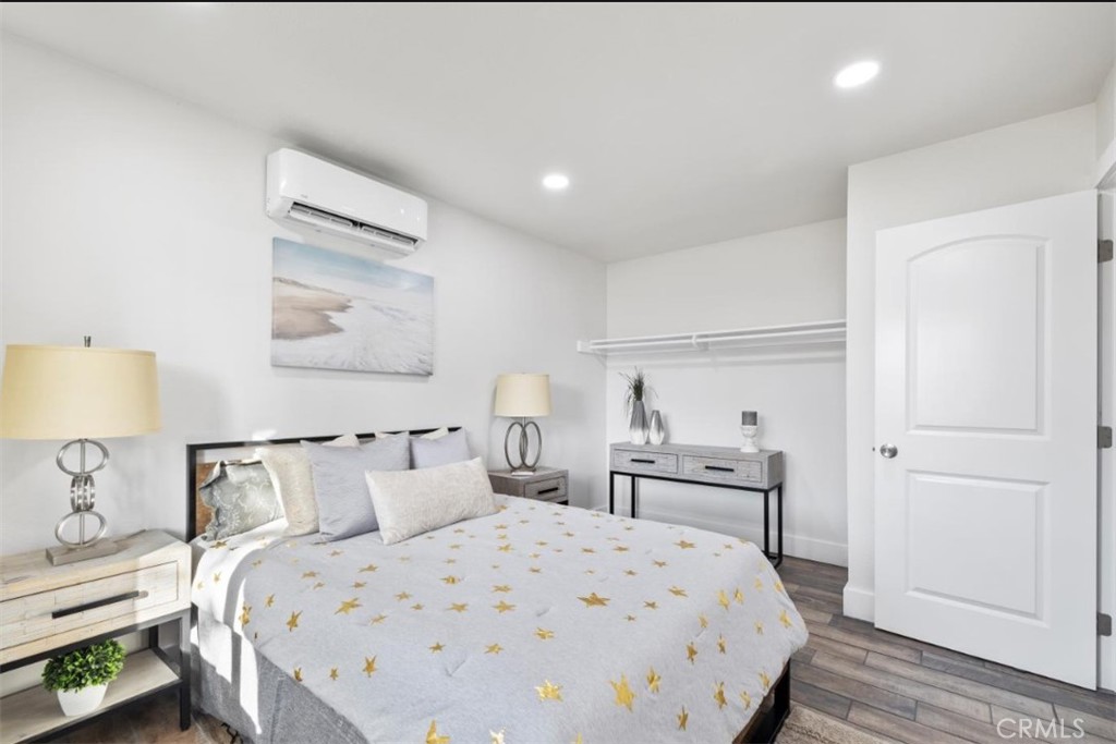 19472 Catfish Circle Huntington Beach, CA 92646 - Photo 19 of 30 a bedroom with a bed and a night stand