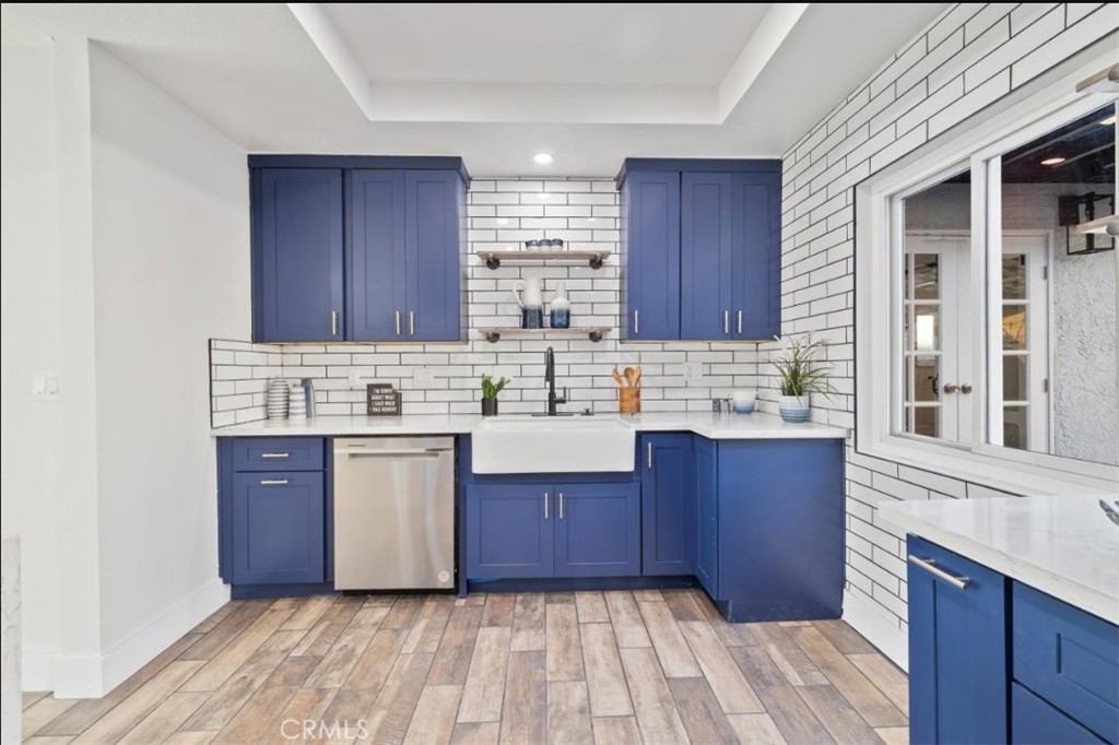 19472 Catfish Circle Huntington Beach, CA 92646 - Photo 24 of 30 a kitchen with a sink stove and cabinets