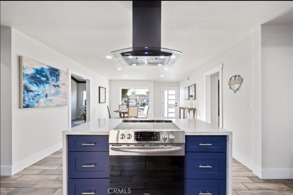 19472 Catfish Circle Huntington Beach, CA 92646 - Photo 26 of 30 a kitchen with stainless steel appliances granite countertop a stove and cabinets
