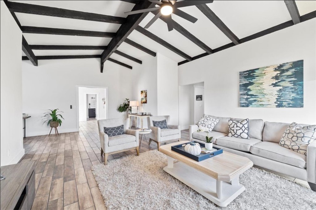 19472 Catfish Circle Huntington Beach, CA 92646 - Photo 4 of 30 a living room with furniture and wooden floor