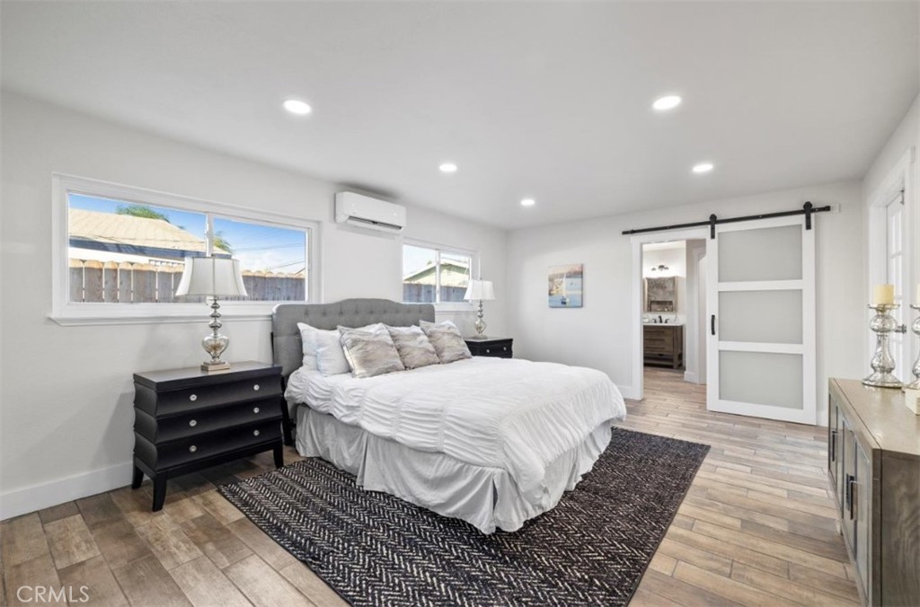 19472 Catfish Circle Huntington Beach, CA 92646 - Photo 5 of 30 a bedroom with a large bed and a window