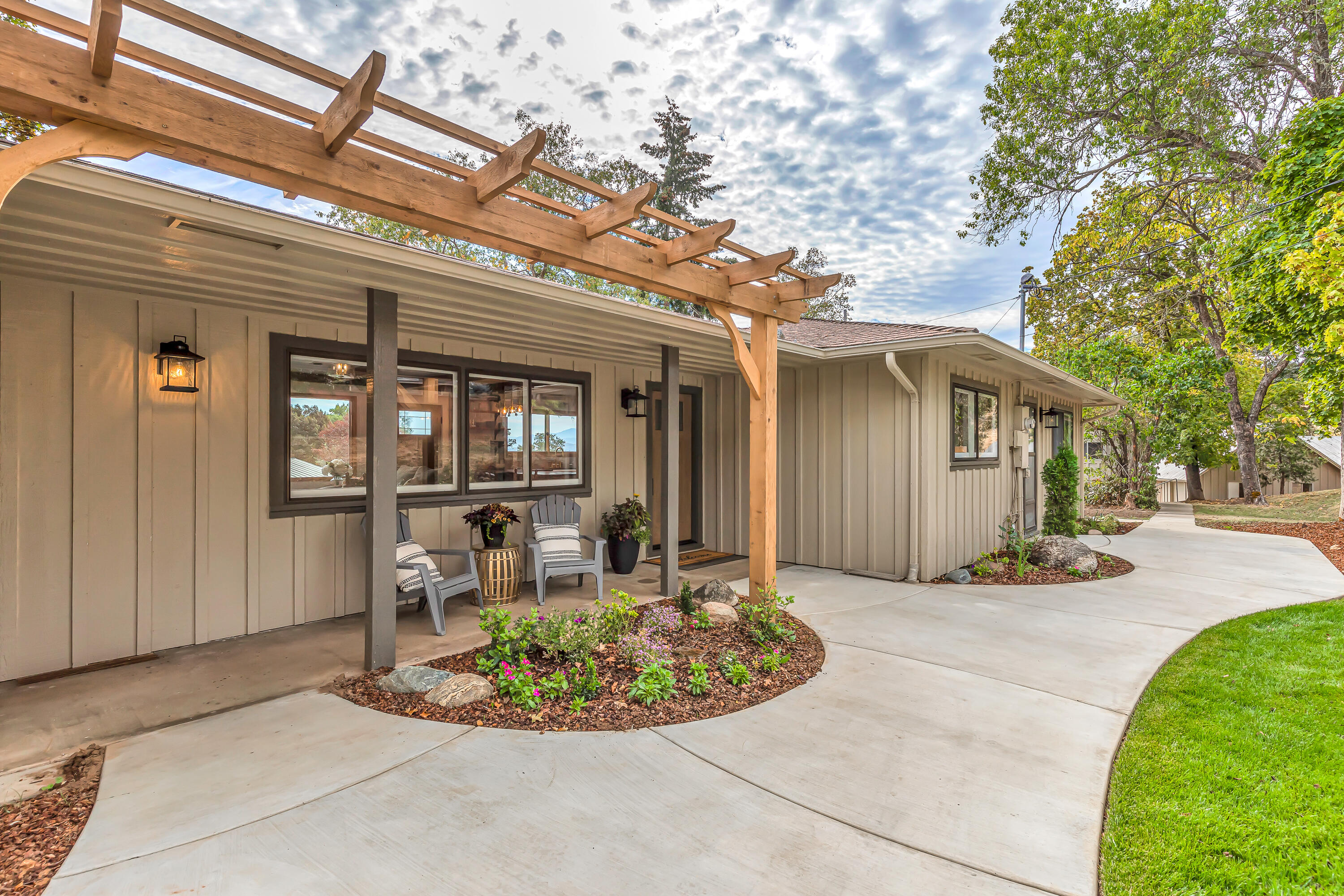 1865 Old Military Road Central Point, OR 97502 - Photo 1 of 77 a view of a house with backyard porch and sitting area
