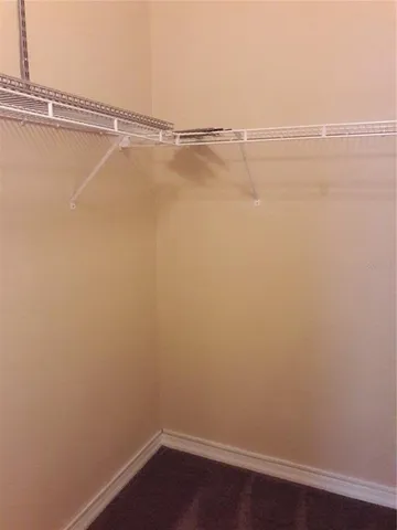 a view of a room with racks on the wall