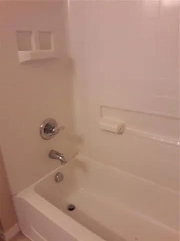 a bathroom with a sink toilet and a mirror