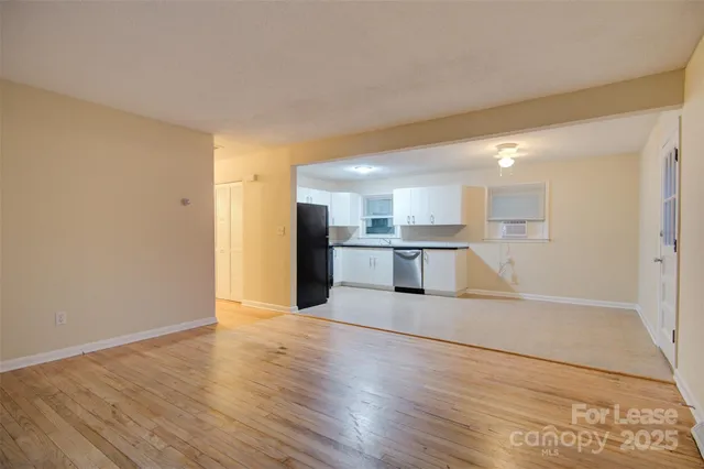 a view of kitchen with wooden floor