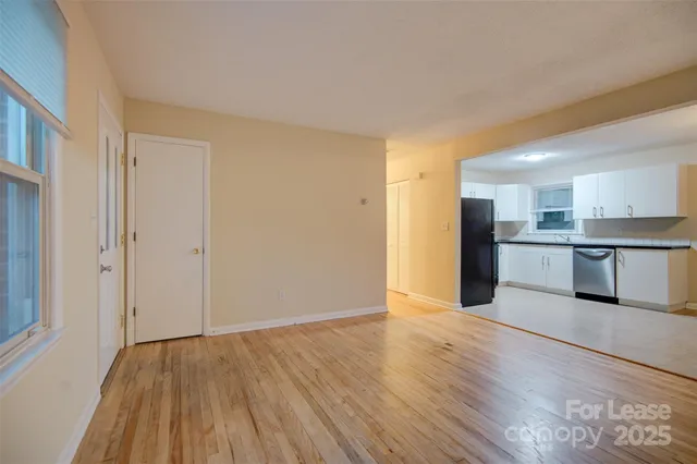 a view of kitchen with wooden floor