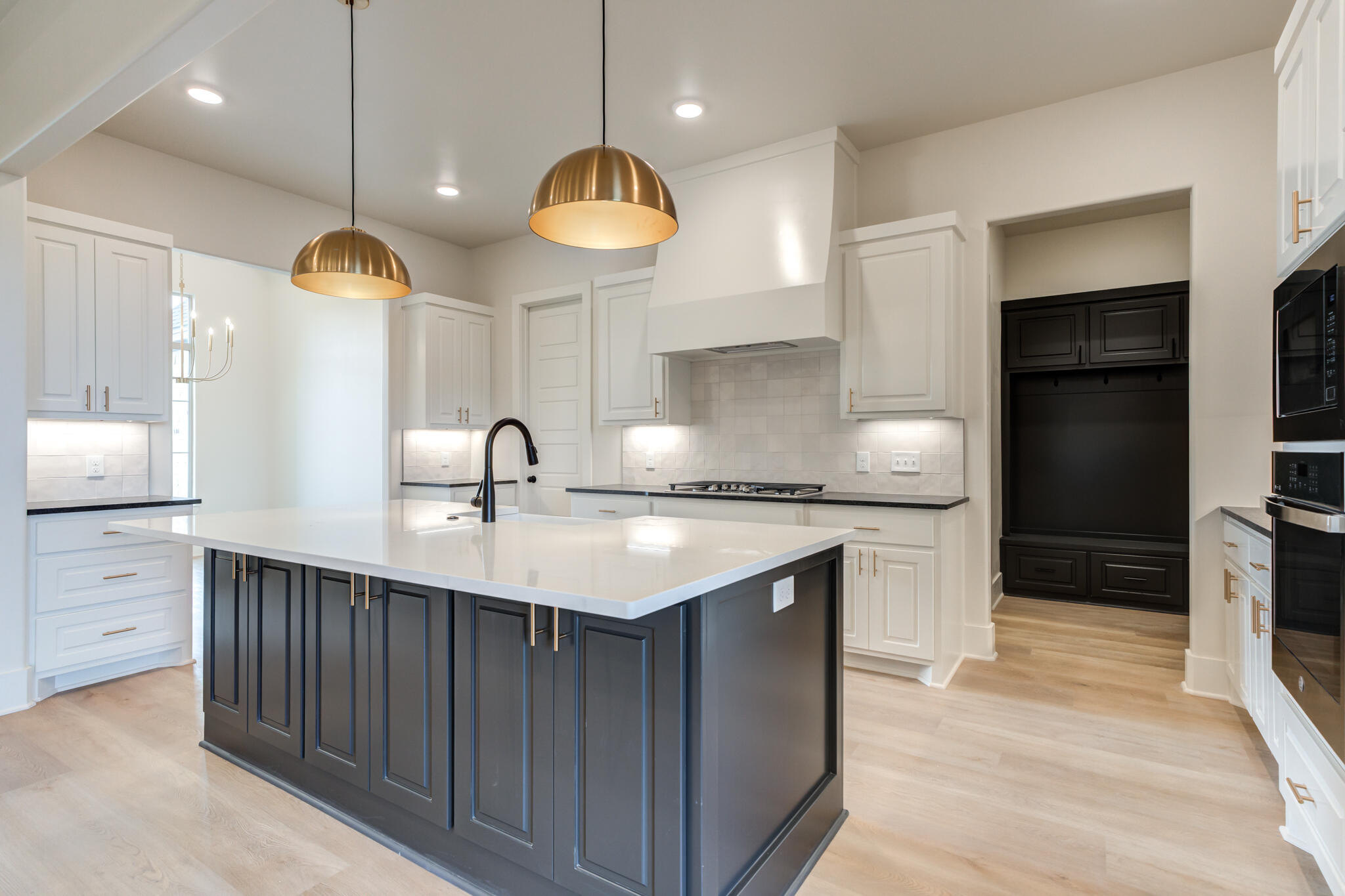 3516 141st Street Lubbock, TX 79423 - Photo 15 of 56 a kitchen with kitchen island a sink stainless steel appliances and cabinets