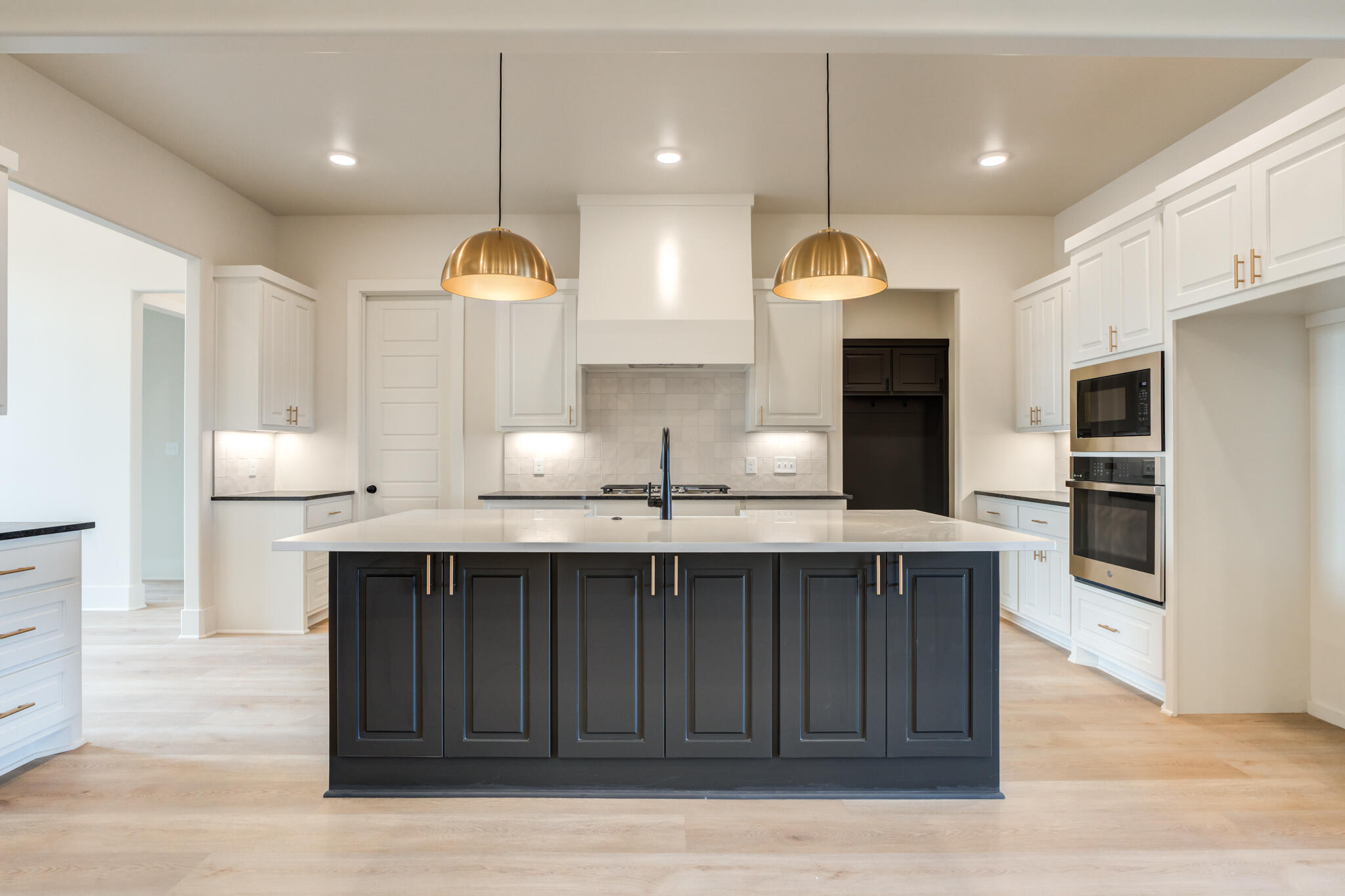 3516 141st Street Lubbock, TX 79423 - Photo 16 of 56 a kitchen with a sink and a refrigerator