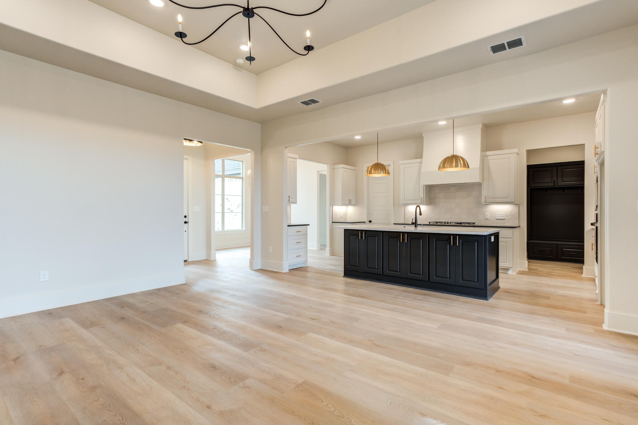 3516 141st Street Lubbock, TX 79423 - Photo 22 of 56 a view of a kitchen with a sink stainless steel appliances and cabinets