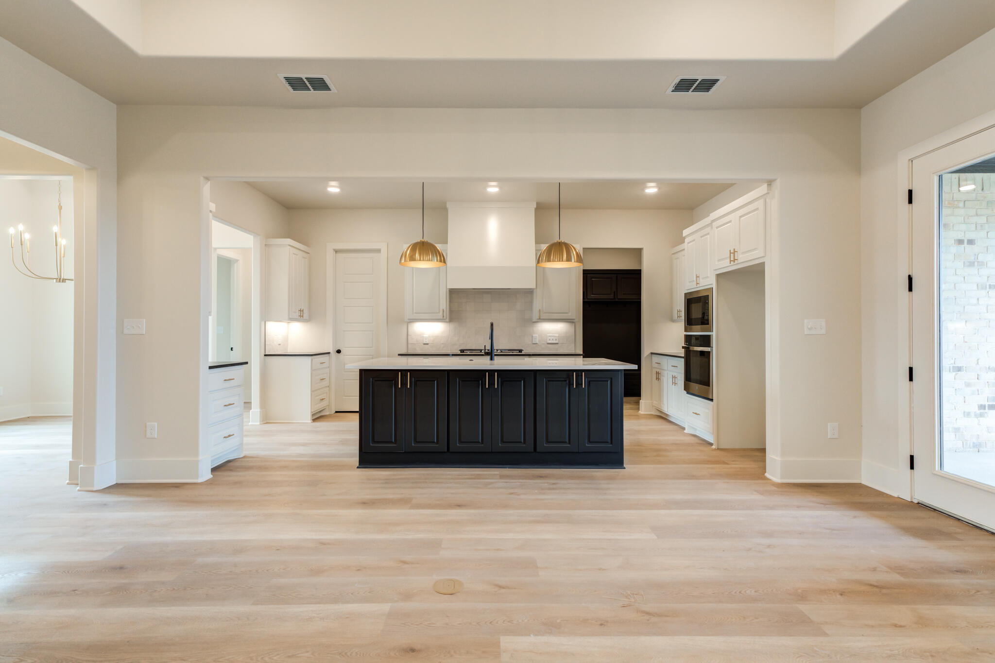 3516 141st Street Lubbock, TX 79423 - Photo 23 of 56 a view of kitchen with kitchen island microwave and cabinets