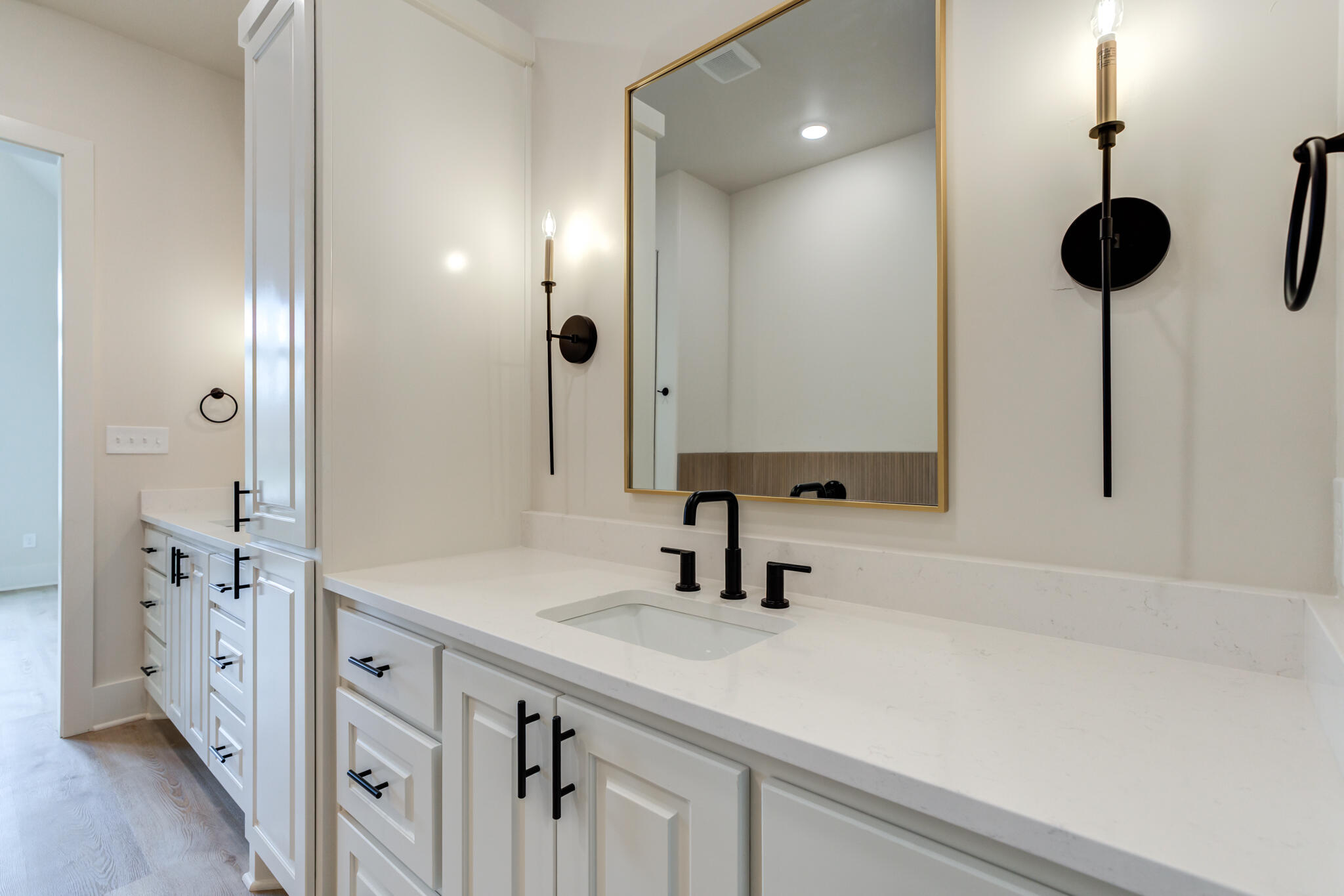 3516 141st Street Lubbock, TX 79423 - Photo 36 of 56 a bathroom with a sink and a mirror