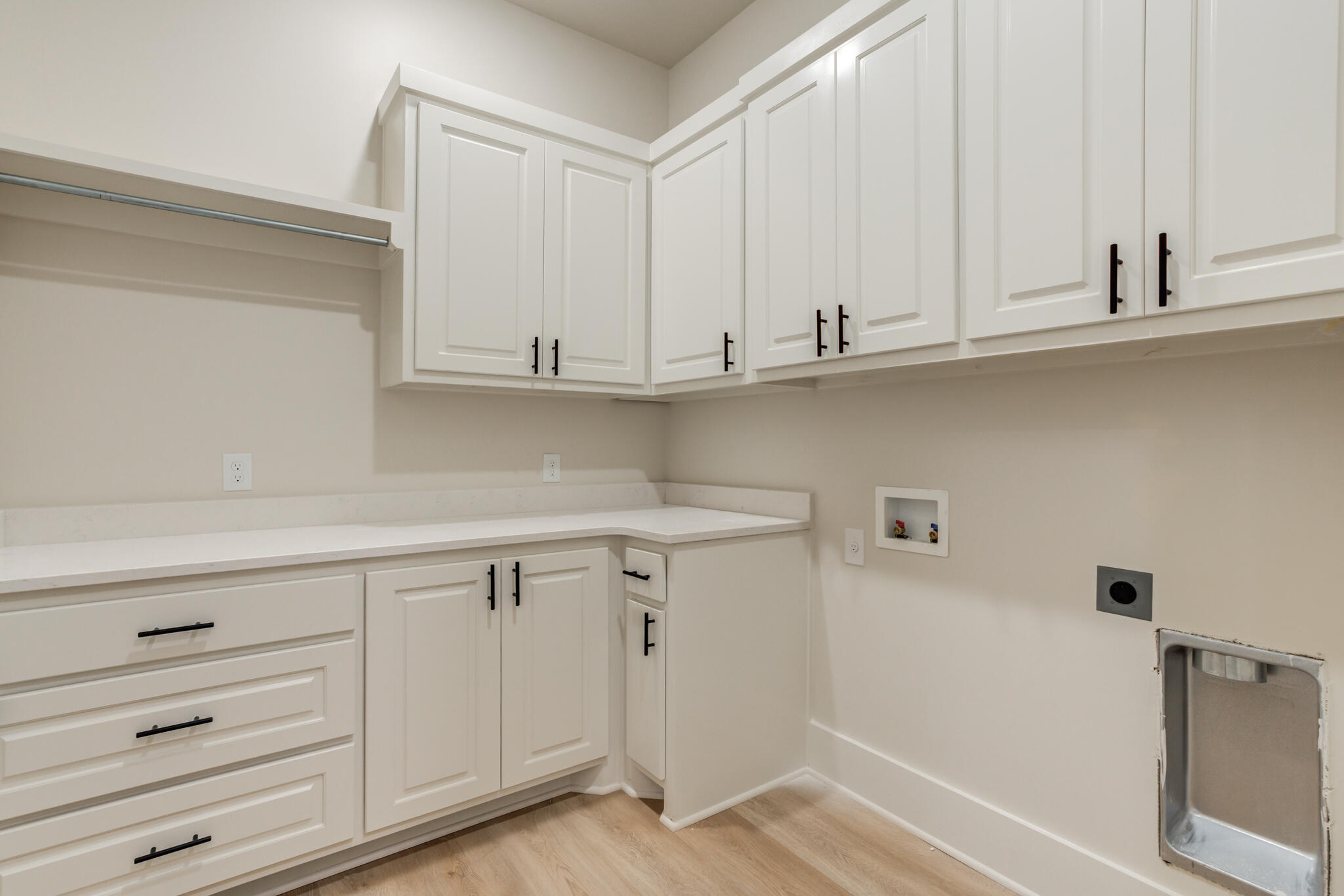 3516 141st Street Lubbock, TX 79423 - Photo 38 of 56 a view of white cabinets and a wooden floor