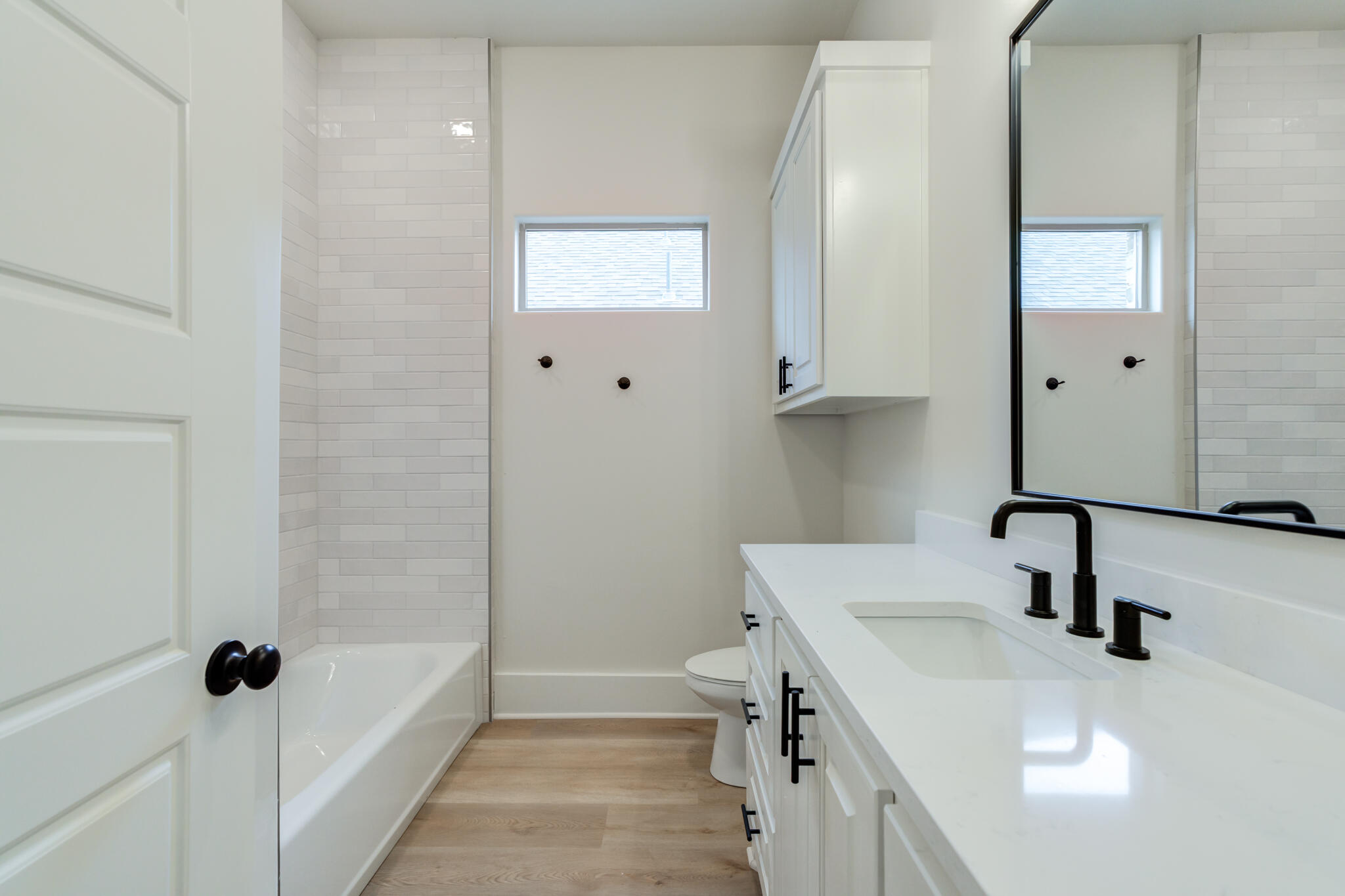 3516 141st Street Lubbock, TX 79423 - Photo 47 of 56 a bathroom with a sink and a tub