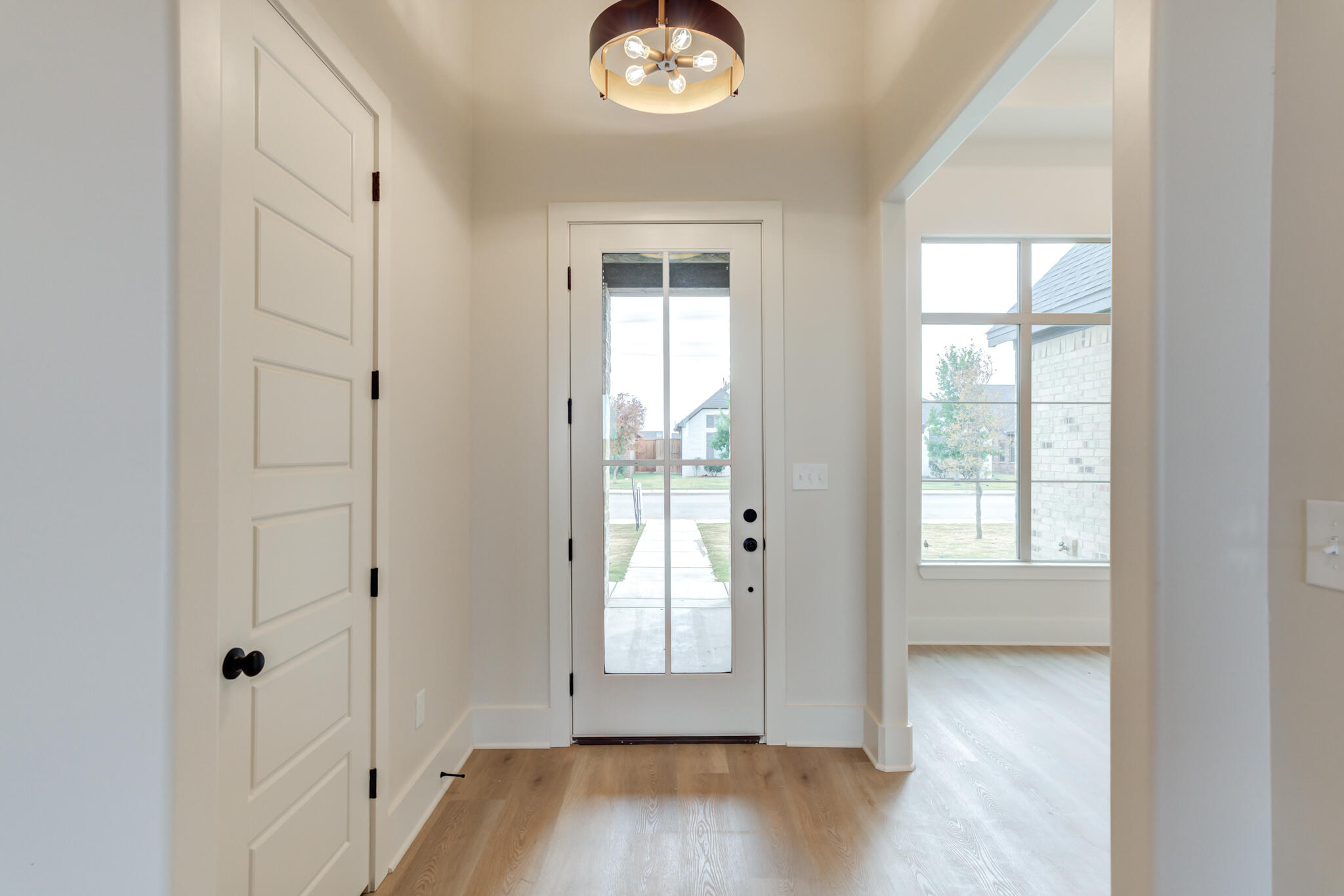 3516 141st Street Lubbock, TX 79423 - Photo 5 of 56 a view of an empty room with window and wooden floor