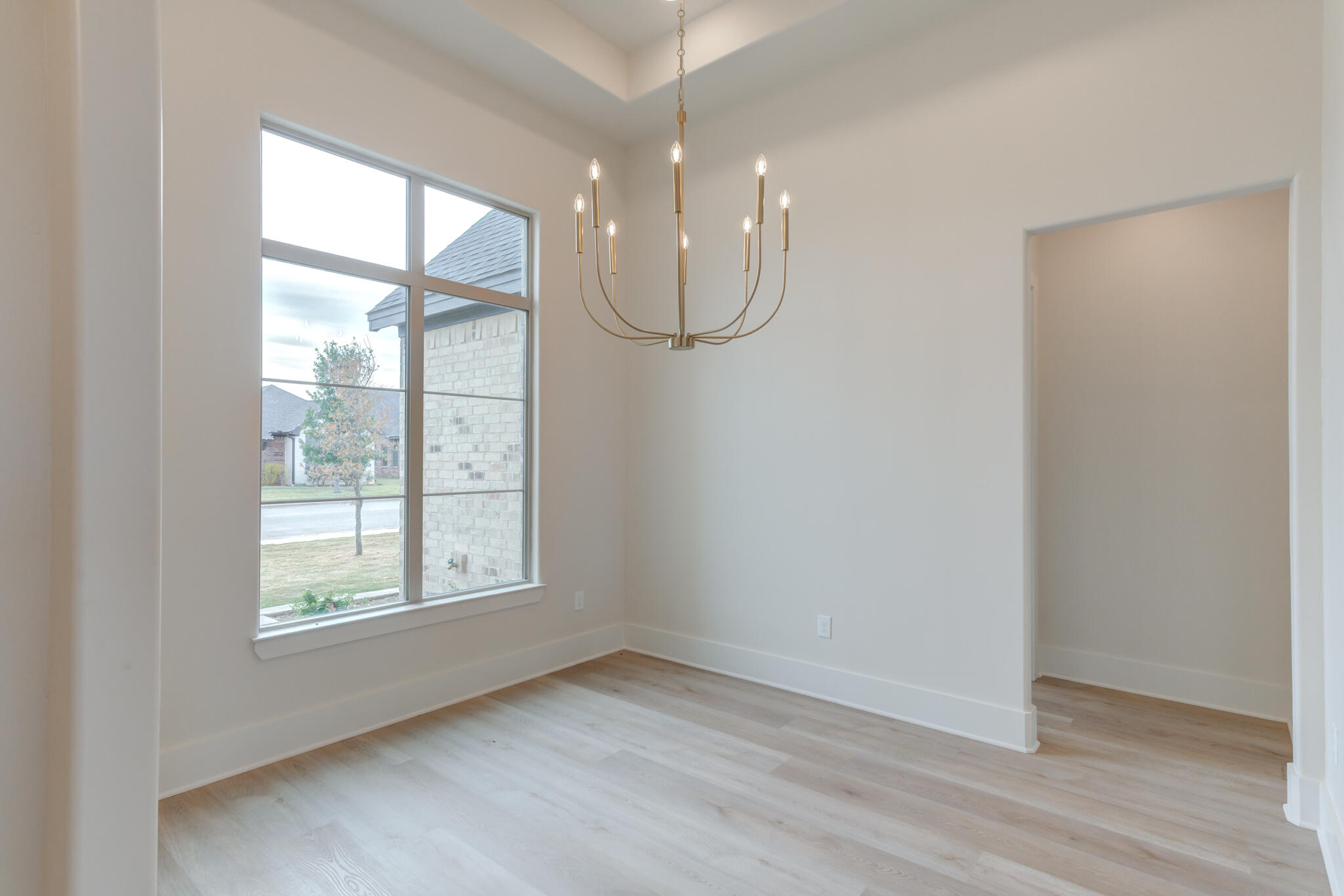 3516 141st Street Lubbock, TX 79423 - Photo 6 of 56 a view of a room with window and wooden floor