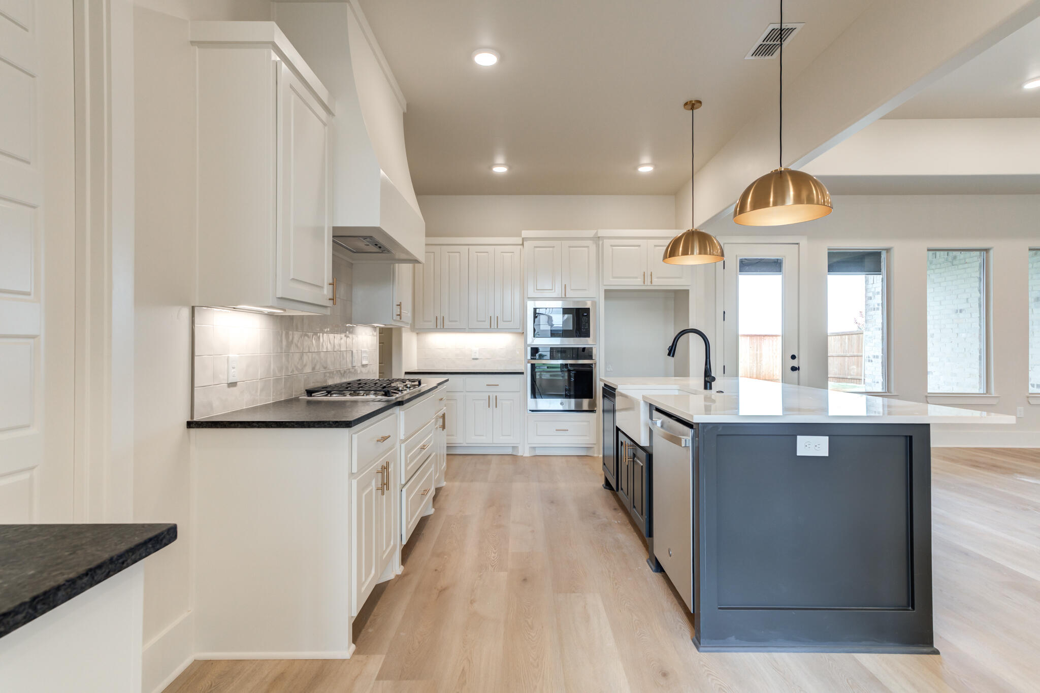3516 141st Street Lubbock, TX 79423 - Photo 8 of 56 a kitchen with stainless steel appliances granite countertop a sink a stove and a refrigerator