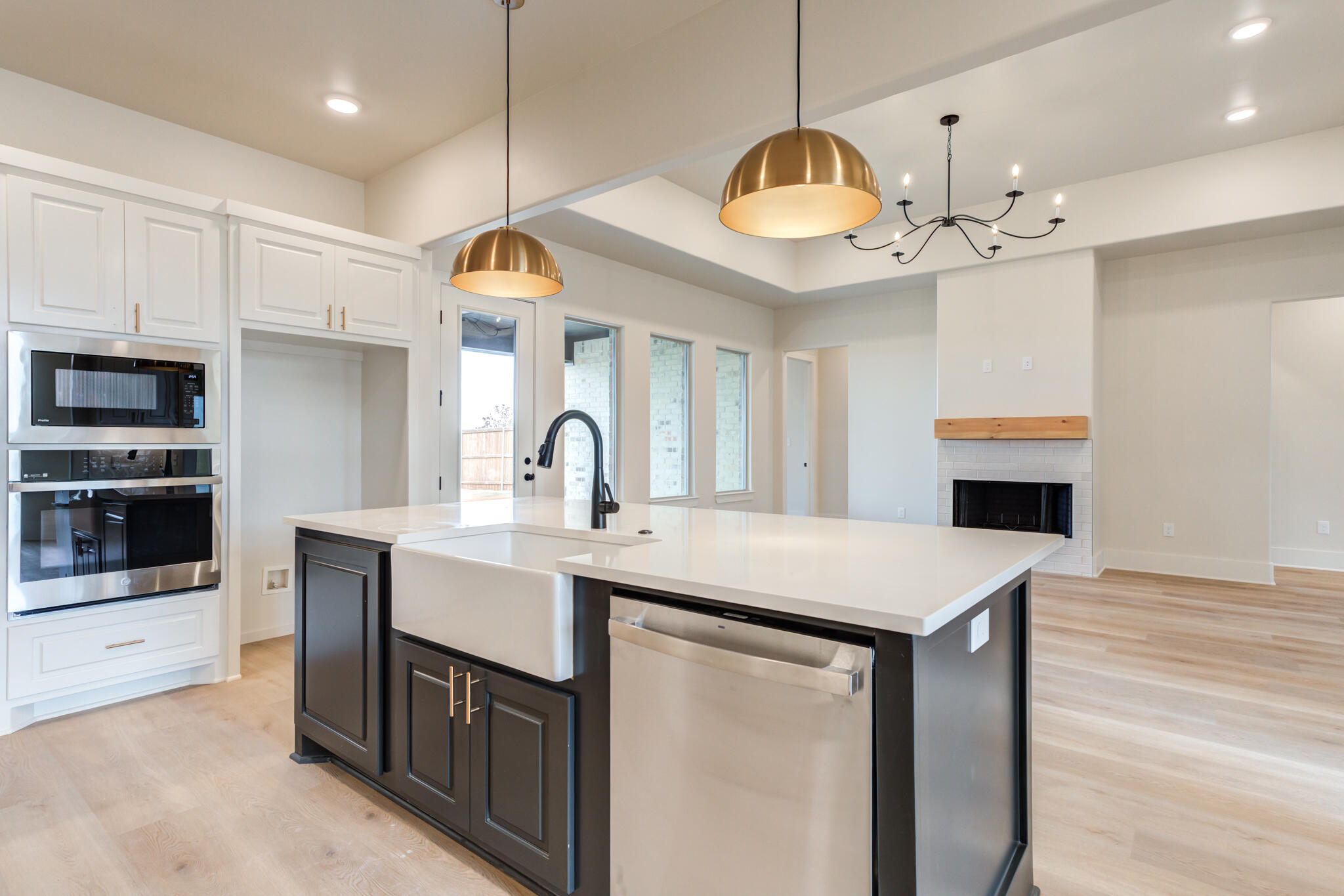 3516 141st Street Lubbock, TX 79423 - Photo 10 of 56 a kitchen with a sink and a stove top oven