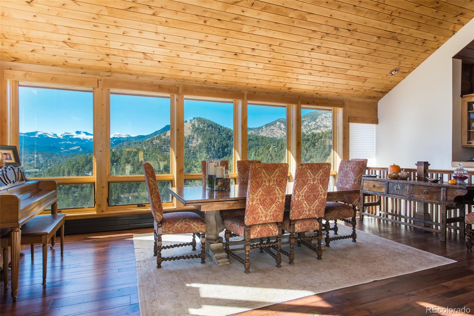 3731 Overlook Trail Evergreen, CO 80439 - Photo 11 of 35 a view of a dining room with furniture and window