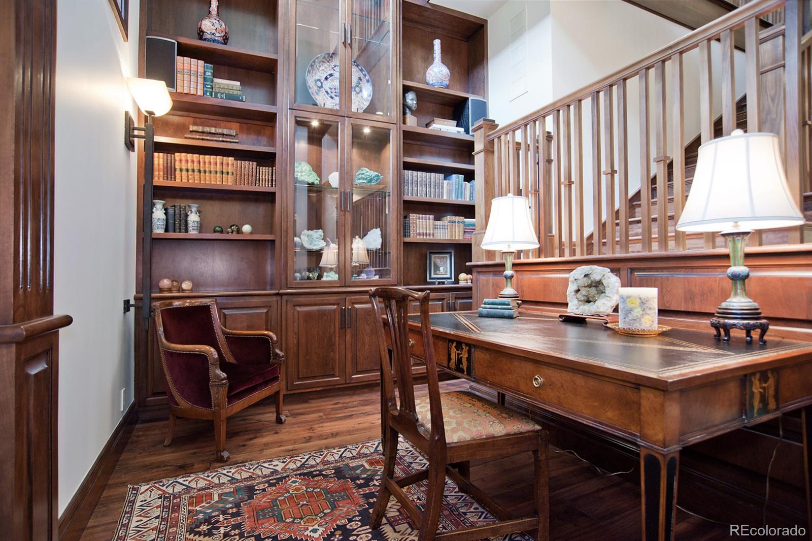 3731 Overlook Trail Evergreen, CO 80439 - Photo 12 of 35 a kitchen with a chair and cabinets