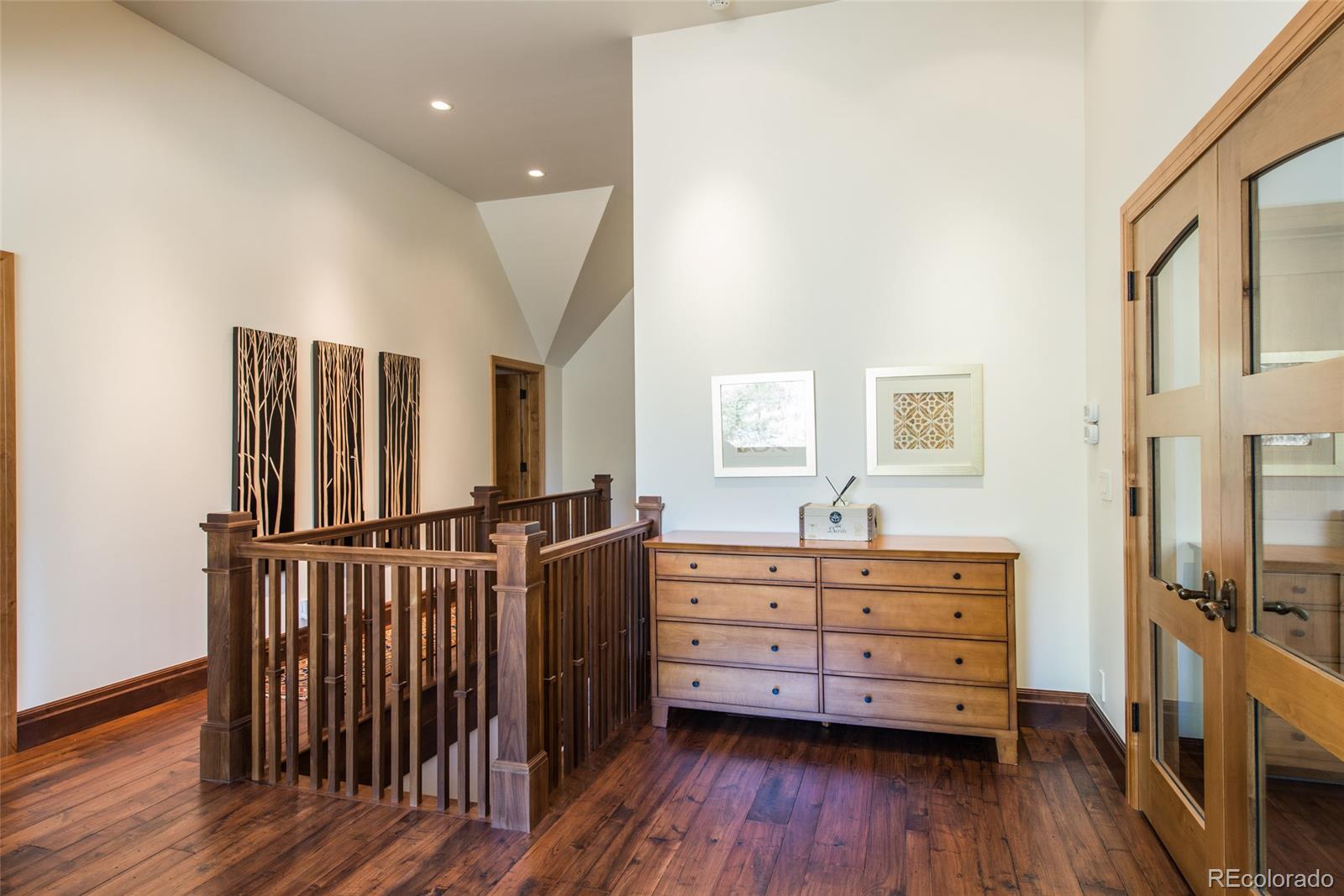 3731 Overlook Trail Evergreen, CO 80439 - Photo 13 of 35 a view of a bedroom with furniture and wooden floor