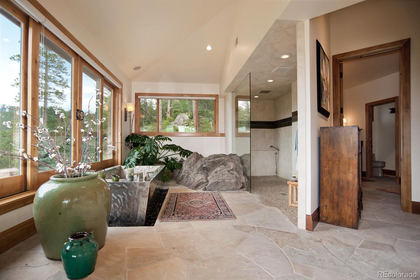 3731 Overlook Trail Evergreen, CO 80439 - Photo 19 of 35 a living room filled with furniture and a large window