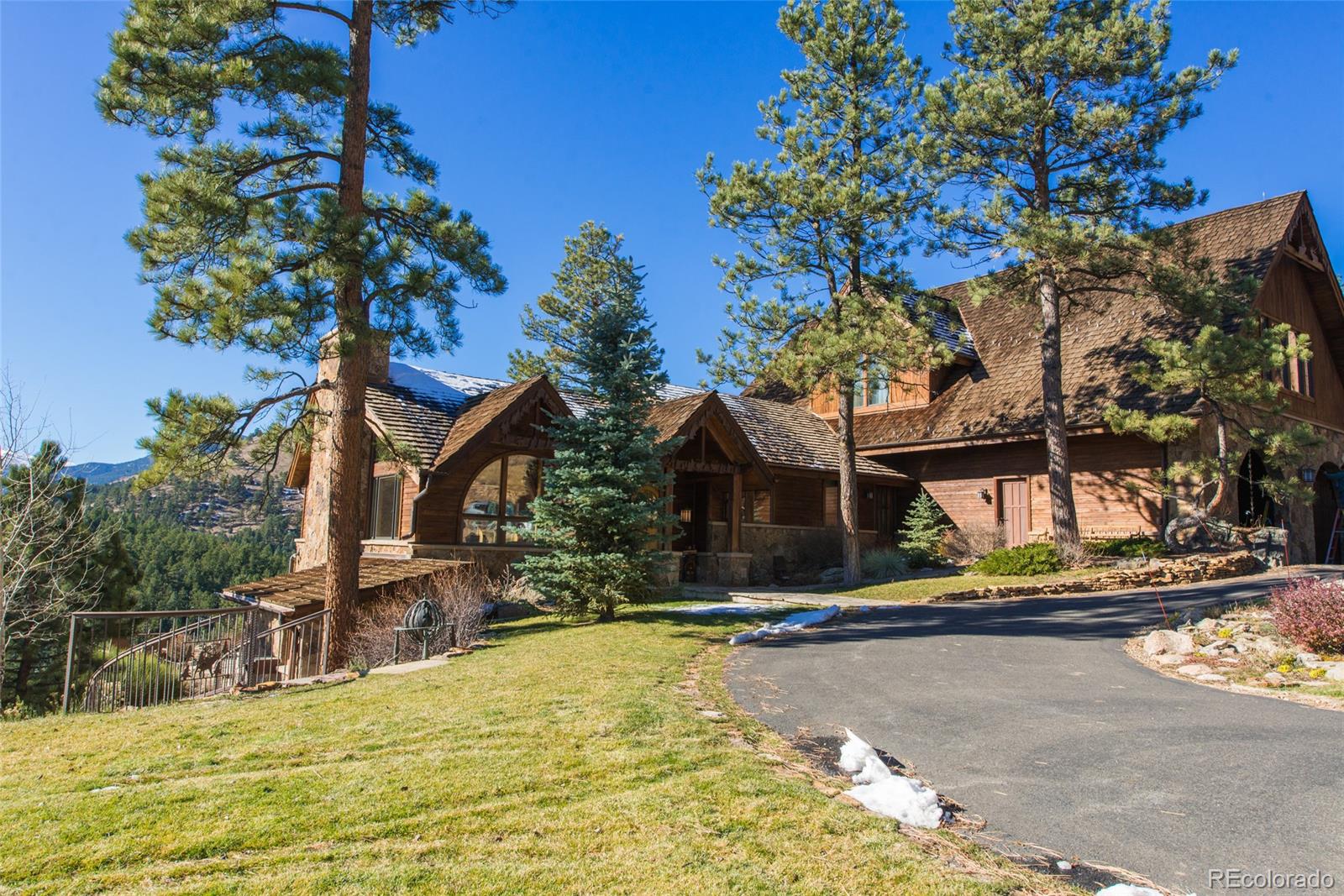 3731 Overlook Trail Evergreen, CO 80439 - Photo 2 of 35 a view of a house with swimming pool