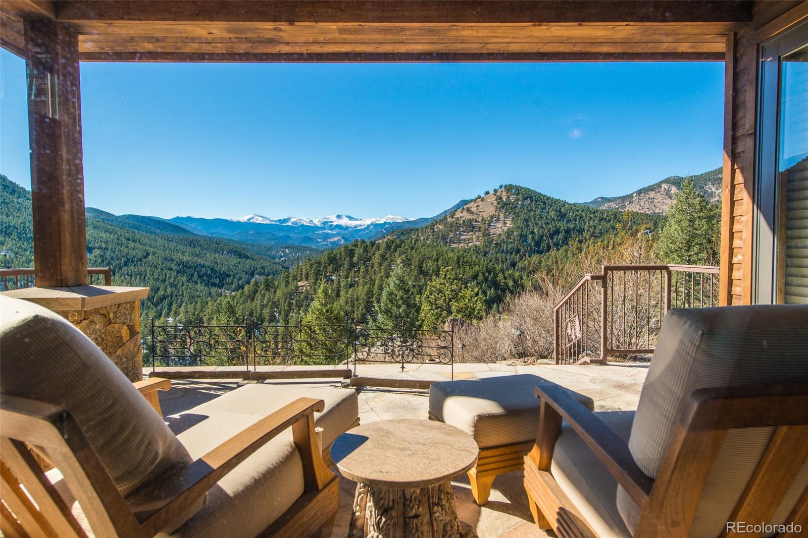 3731 Overlook Trail Evergreen, CO 80439 - Photo 21 of 35 a view of a chairs and table in patio
