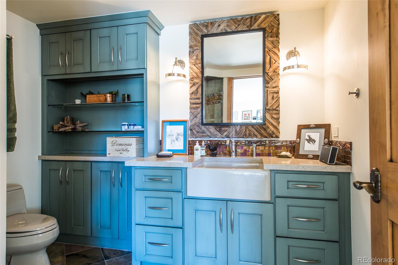 3731 Overlook Trail Evergreen, CO 80439 - Photo 32 of 35 a kitchen with a sink a stove and cabinets