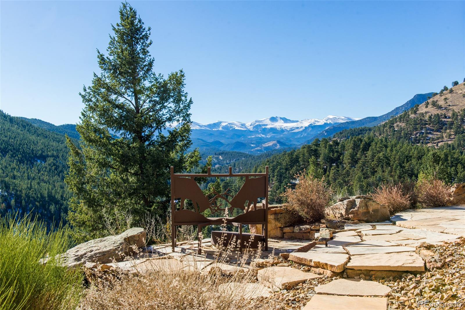 3731 Overlook Trail Evergreen, CO 80439 - Photo 33 of 35 a view of a backyard with sitting area