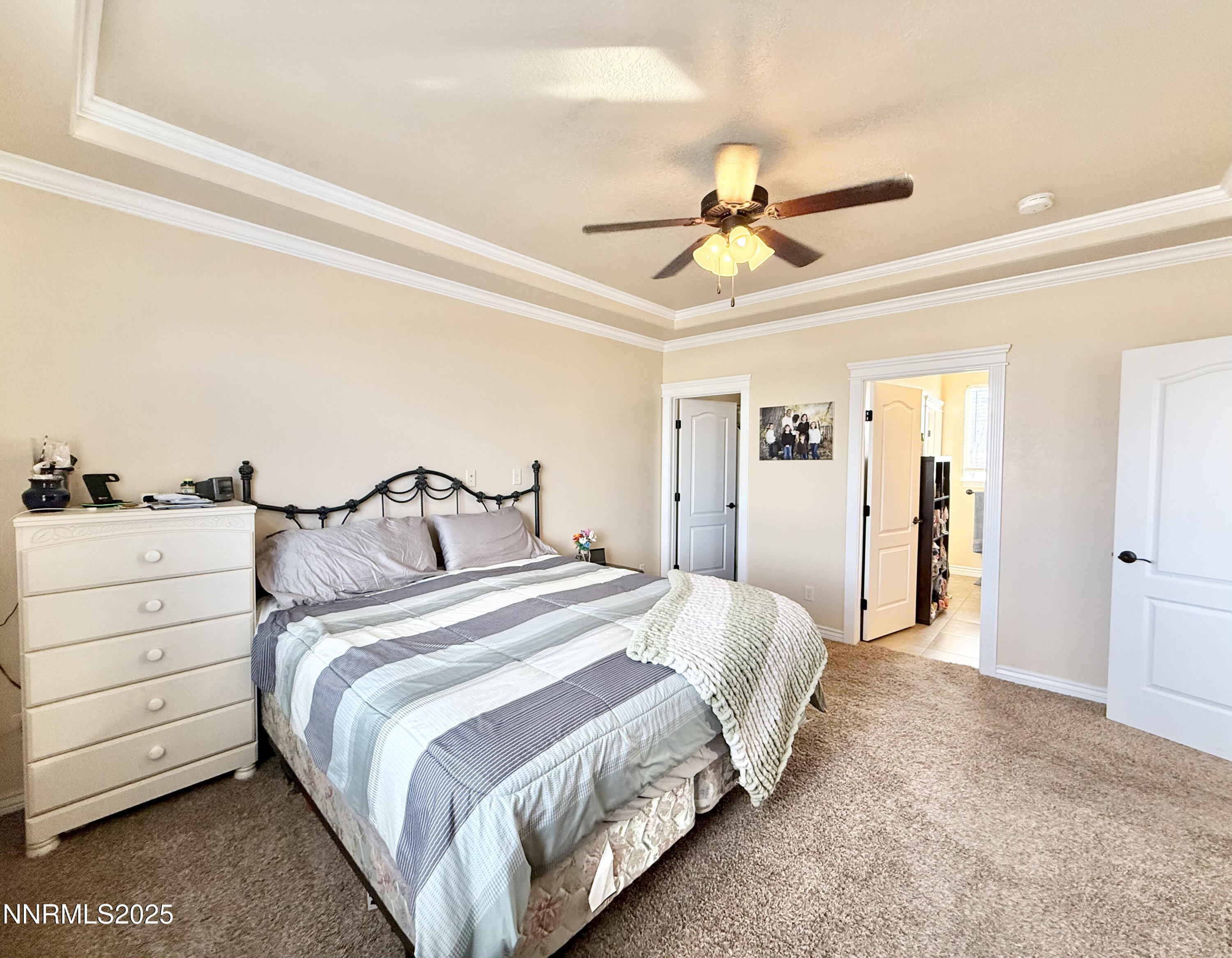 170 Blue Ridge Road Battle Mountain, NV 89820 - Photo 13 of 39 a bedroom with a bed and a chandelier