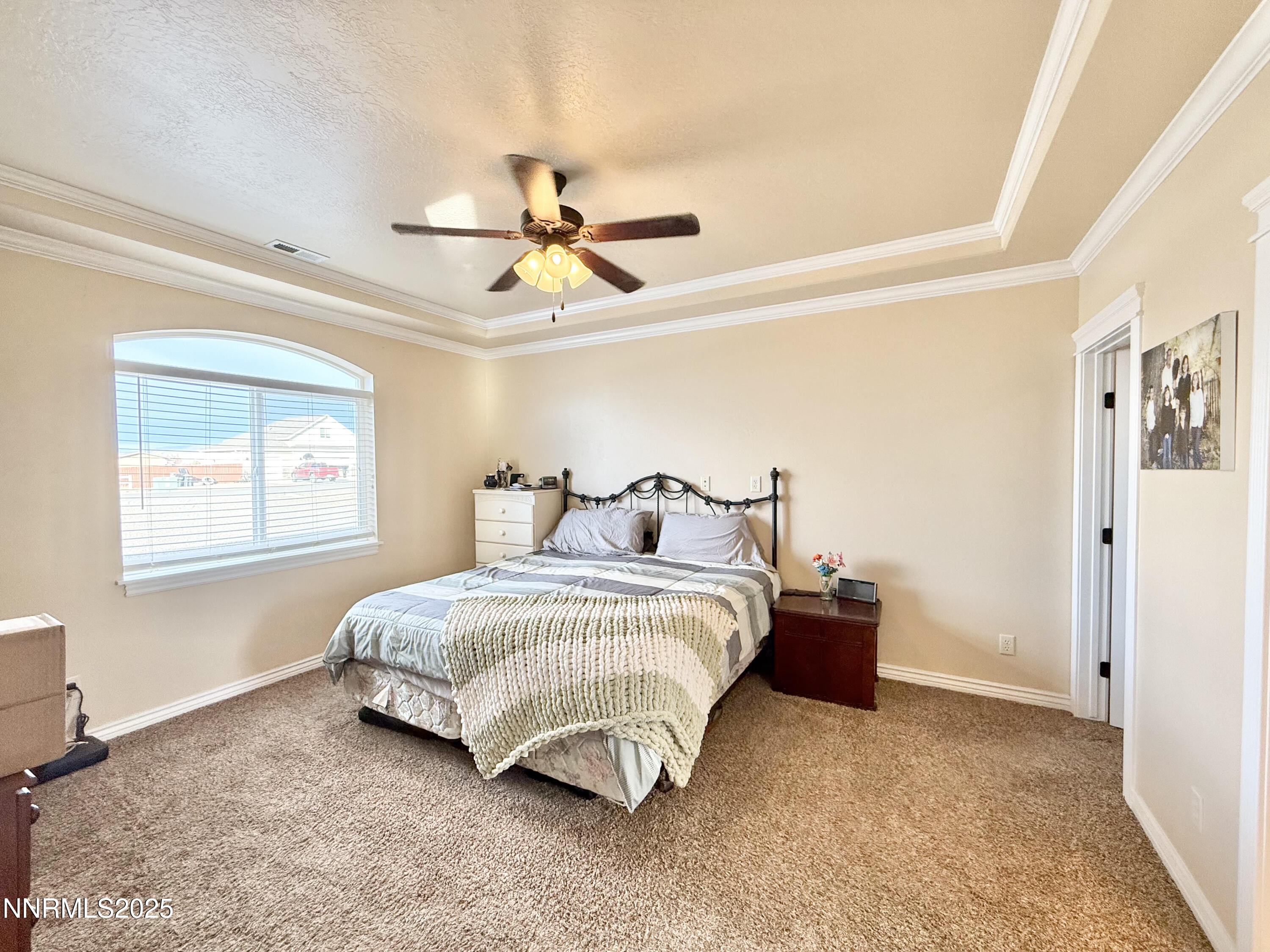 170 Blue Ridge Road Battle Mountain, NV 89820 - Photo 15 of 42 a bedroom with a bed ceiling fan and a window
