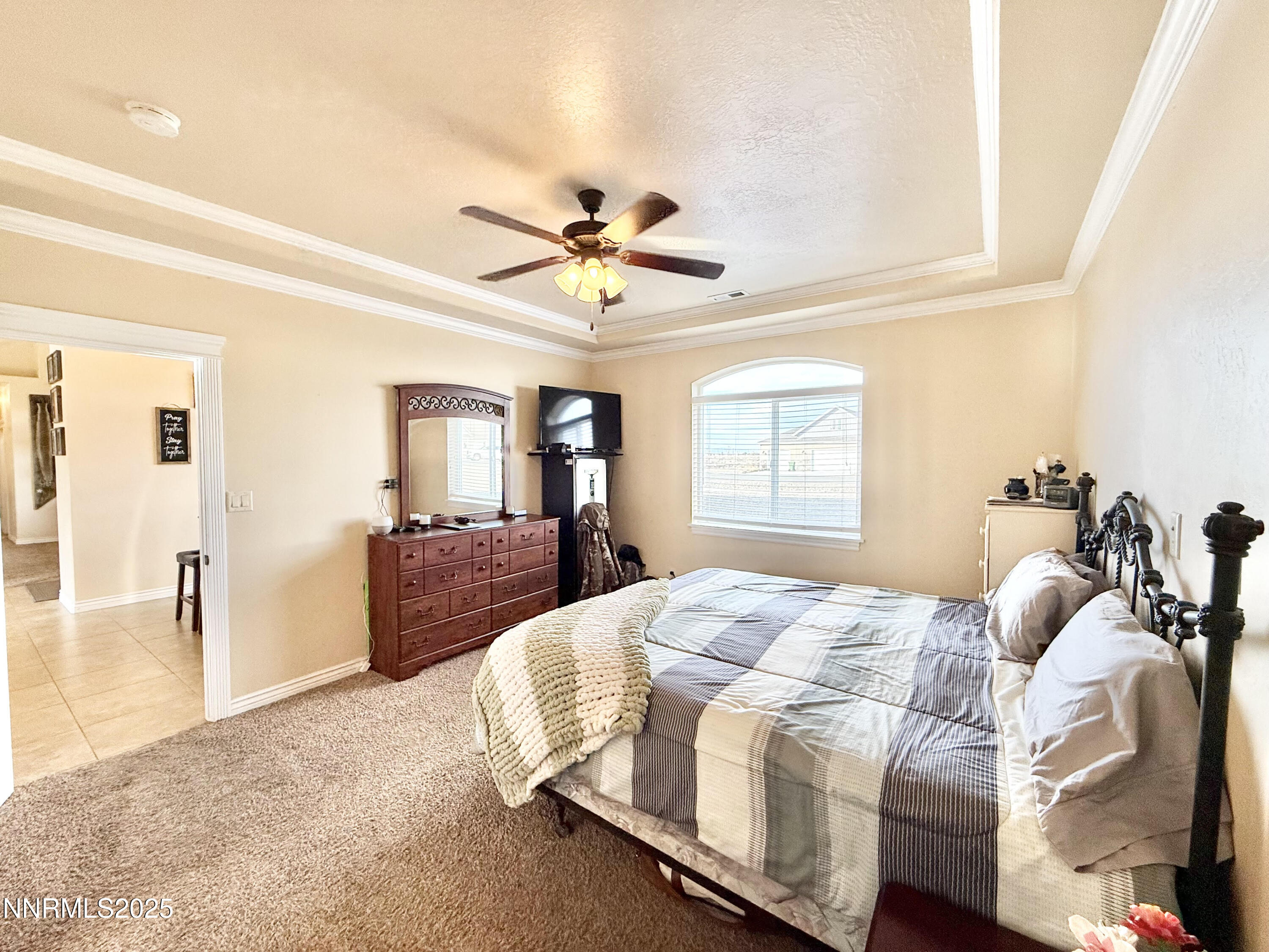 170 Blue Ridge Road Battle Mountain, NV 89820 - Photo 17 of 42 a bedroom with a bed and a chandelier