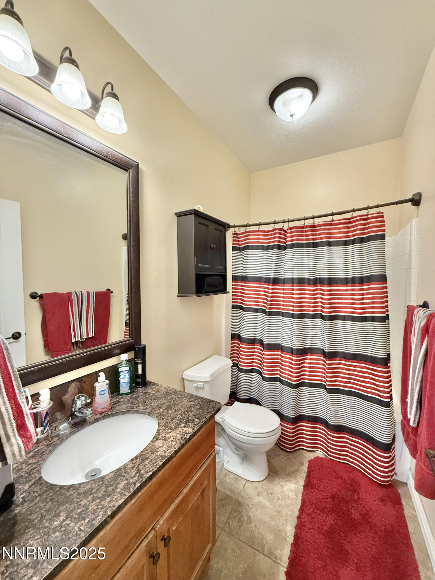 170 Blue Ridge Road Battle Mountain, NV 89820 - Photo 26 of 39 a bathroom with a granite countertop toilet sink and mirror